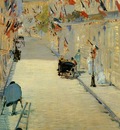 rue mosnier decorated with flags with a man on crutches