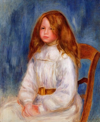 seated little girl with a blue background
