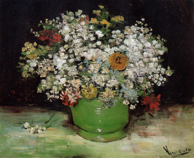vase with zinnias and other flowers